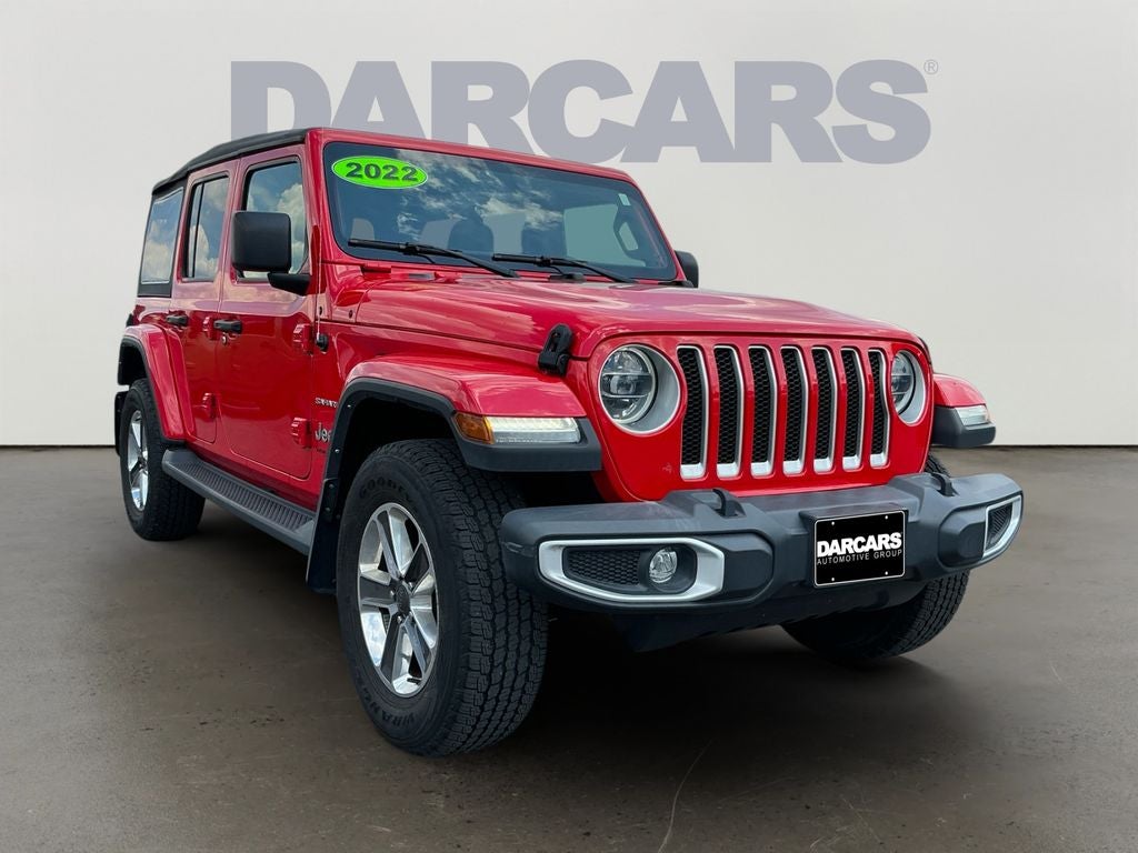 2022 Jeep Wrangler Unlimited Sahara in Firecracker Red Clearcoat — front three-quarter view