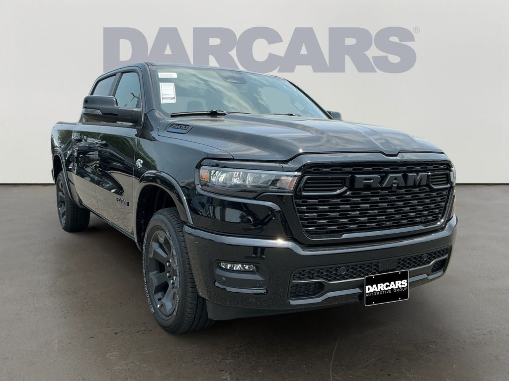 2026 RAM 1500 Big Horn/Lone Star in Diamond Black Crystal Pearl-Coat Exterior Paint — front three-quarter view